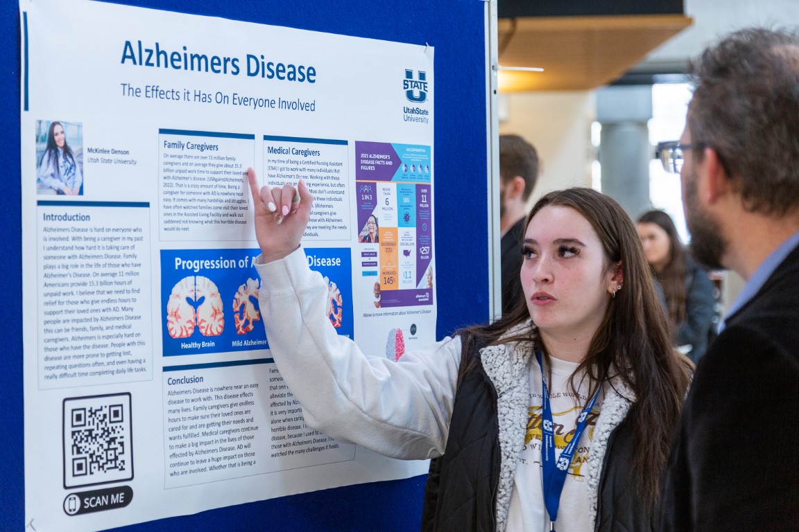 Student explaining Alzheimers Disease research project