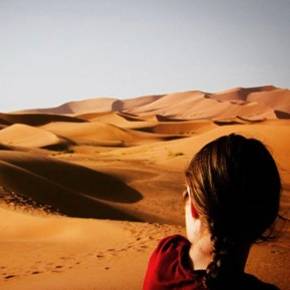 Rachel Funk in front of a sand dune