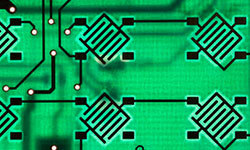 Stylized green circuit-board pattern with interconnected electronic components and signal paths, representing wireless signal flow. The image conceptually illustrates using ambient signals, like Wi-Fi, to track movement and position without direct line of sight, as in covert bistatic radar systems.